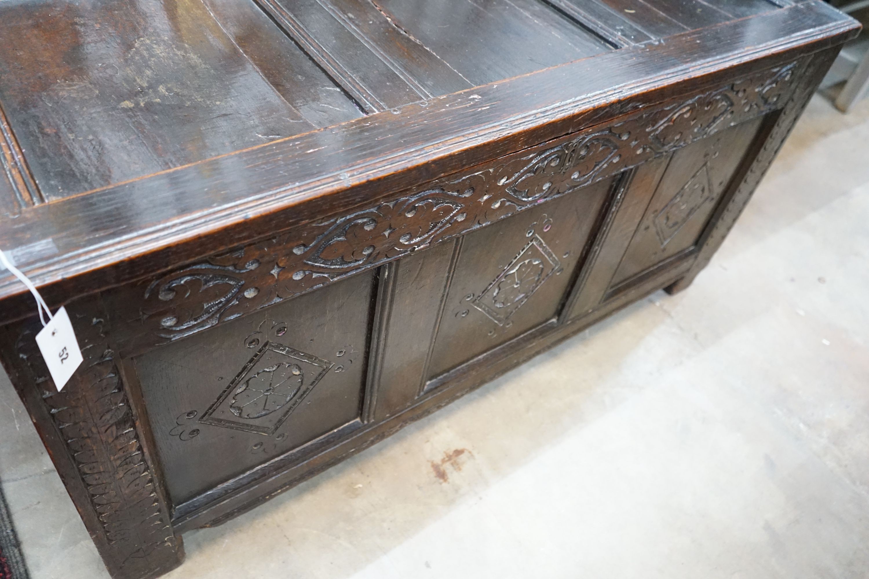 An 18th century carved oak coffer, length 133cm, depth 57cm, height 64cm